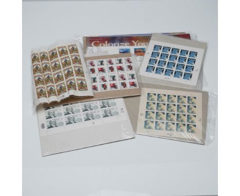 Group of seven mint U.S. postage stamp sheets, each showcasing distinct themes and denominations. Includes 28¢ Polar Bear she