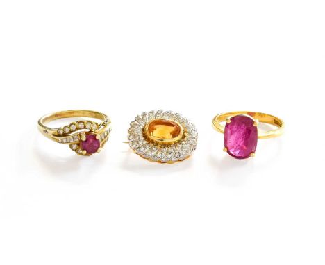 A Topaz and Diamond Brooch, unmarked, measures 1.8cm by 1.6cm; A Ruby and Diamond Ring, stamped '585', finger size K, stamped