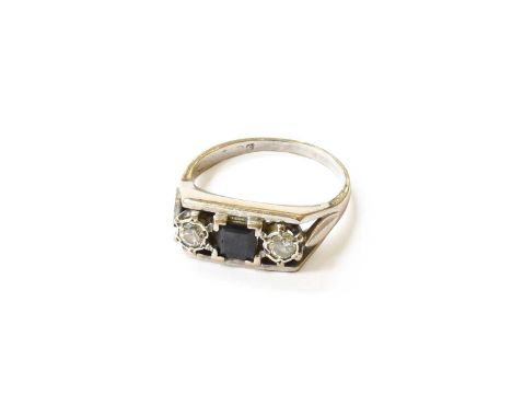 An 18 Carat White Gold Sapphire and Diamond Three Stone Ring, the square step-cut sapphire flanked by round brilliant cut dia