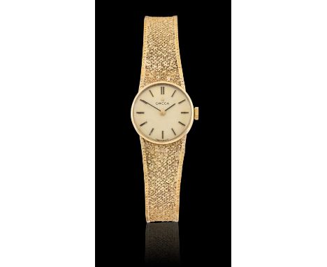 A Lady's 9 Carat Gold Wristwatch, signed Omega, 1972, manual wound lever movement, Omega 9 carat gold textured integral brace