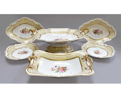 A Spode Felspar Porcelain Dessert Service, circa 1820, the pale yellow borders with oeil de perdrix, framing central bouquets