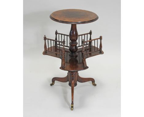 A Victorian walnut pedestal occasional table, with galleried rotating shelf, on tripod base terminating in brass feet, the to