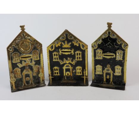 Three 19th century 'Bank' money boxes, brass and steel, two with lamp post to the fore, both labelled 'Bank', the third untit