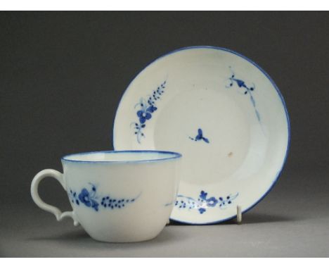 A Caughley tea cup and saucer painted with the Chantilly Sprig B pattern, circa 1786-94, S mark, saucer 14cm diameter (sprung