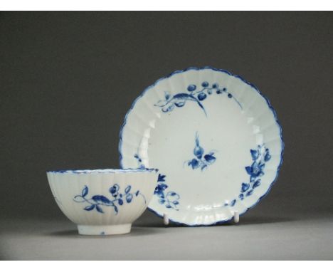 A reeded Caughley tea bowl and saucer painted with the Bright Sprigs pattern, circa 1785-92, S mark, tea bowl 7.9cm diameter 