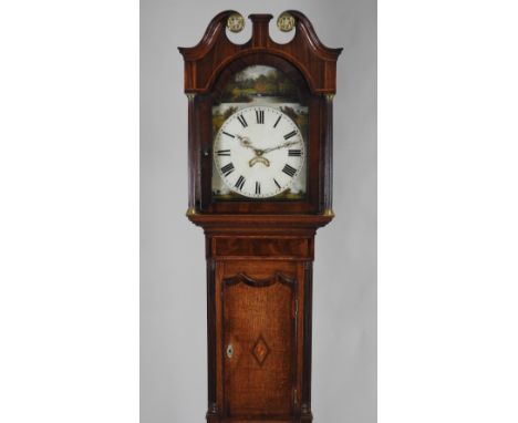 An early 19th century oak crossbanded mahogany thirty hour longcase clock, the 12 inch arch enamel dial with centred date ape