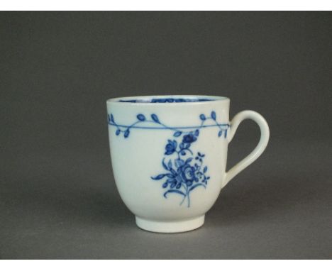 A Caughley coffee cup painted in the very rare 'Trailing Rose Sprays' pattern, circa 1780-88, the strap loop handle with pron