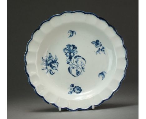 A small pie-crust edge Caughley plate transfer-printed with the Gillyflower 4 pattern, circa 1776-80, partial S mark, 16.7cm 
