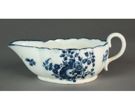 A Caughley sauce boat transfer-printed in the Apple and Damson pattern, circa 1780-88, 5.8cm high, 17cm long (cracked, chippe