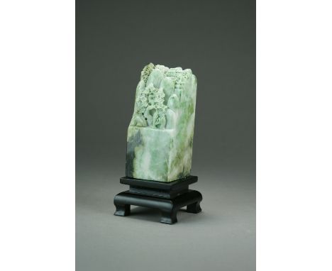 A mottled green jadeite boulder carving, late 20th Century, of square section and carved with two figures of ancients approac