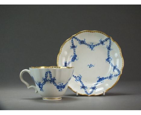 A Caughley coffee cup and saucer painted with the Rose Festoon pattern within gilt dentil rims, circa 1788-93, S mark, cup 5.