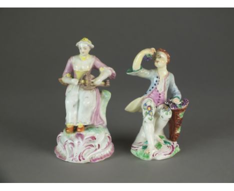 A Bow porcelain figure of Columbine, c.1760-65, seated on a low stump and playing the hurdy-gurdy, on a pink scrolled base, 1