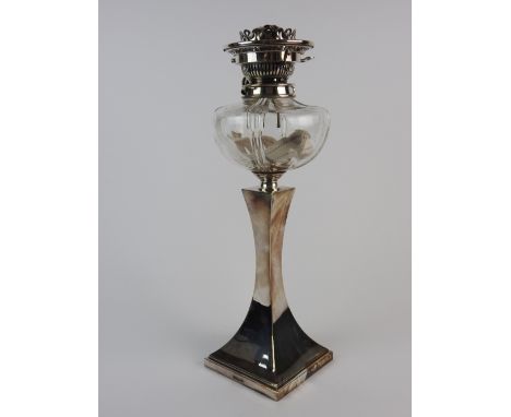 A late Victorian silver plated oil lamp, by Hawksworth Eyre and Co. with clear glass reservoir (lacking chimney and shade), a