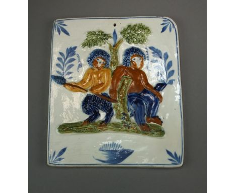 A 19th century rectangular Prattware plaque decorated in relief with pair of mythical creatures or satyrs sat with a hunting 
