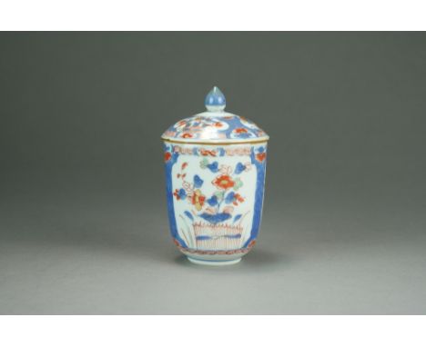 A Chinese Imari chocolate cup and cover, Qianlong, of beaker form, the domed cover with cone finial, decorated in underglaze 