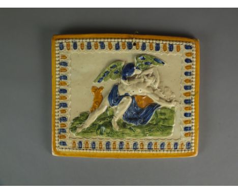 A rectangular Prattware plaque depicting Prometheus chained to a rock being attacked by an eagle, circa 1800, unmarked, 19cm 