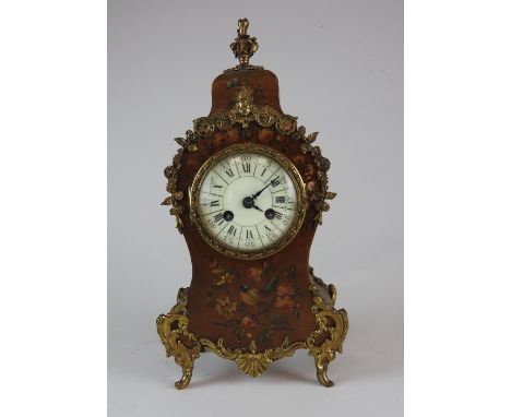 A Louis XV style late 19th century polychrome decorated mantel clock, the 3.25 inch enamel dial with inner ring of Roman nume