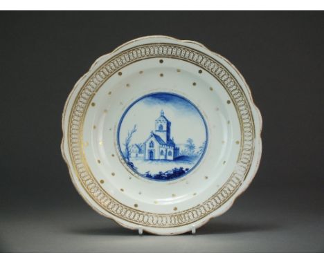 A Caughley dessert plate with a blue painted scene within a gilt spangled border, circa 1785-93, impressed Salopian mark, 20.