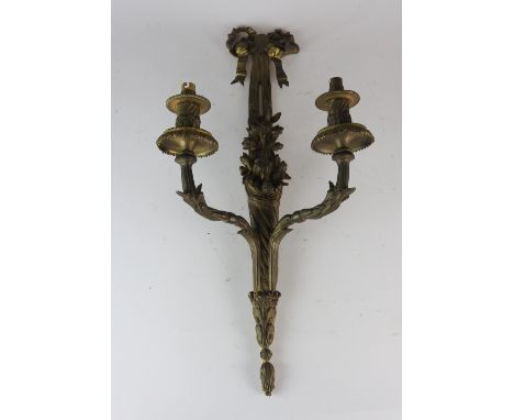 A pair of 20th century metal Empire style two light wall appliques, 64cm high (2)