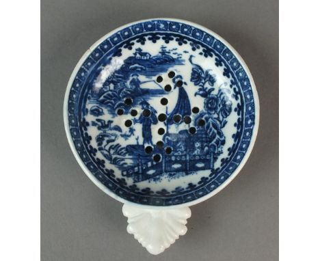 A Caughley egg drainer transfer-printed with the Pleasure Boat or Fisherman pattern, circa 1780-90, with leaf shaped handle, 
