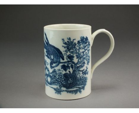 A Caughley mug, circa 1785-1792, transfer-printed in underglaze blue with the Parrot Pecking Fruit pattern, unmarked, 13.5cm 