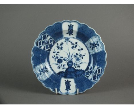 A lobed Caughley plate painted with the Scholar's Rock pattern within powder blue border, circa 1776-82, impressed Salopian m