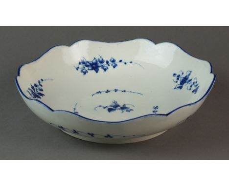 A Caughley salad bowl painted with the Bright Sprigs pattern, circa 1786-92, S mark, 23.4cm wide (hairline)Provenance: Wright