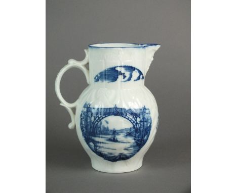 An exceptionally important Caughley mask-head jug, printed in blue on both sides with a 'Severn Trow' passing underneath the 