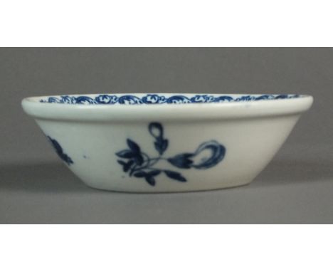 A Caughley tart or patty pan transfer-printed with the Fruit and Wreath pattern, circa 1780-85, C mark, 10.3cm diameterProven