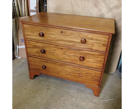 A Victorian satinwood chest of drawers, having three graduated long drawers, raised on bracket feet, width 40ins, height, 34i