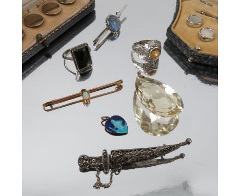 A collection of jewellery, including a large citrine pendant, a cased opal bar brooch, two stick pins, cased dress buttons, a