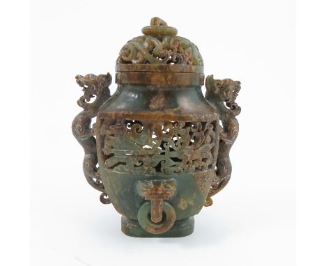 An Oriental carved soap stone covered vase, with pierced decoration, figural handles and ring masks, height 5ins