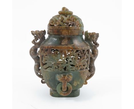 An Oriental carved soap stone covered vase, with pierced decoration, figural handles and ring masks, height 5ins