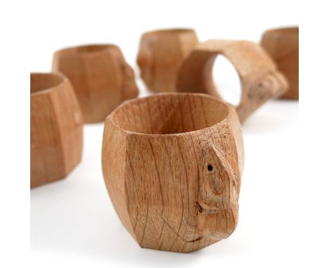 A set of six Robert Thompson of Kilburn Mouseman oak napkin rings, of octagonal ovoid form, height 1.75ins, maximum width 2.5