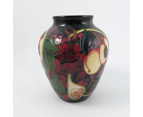 A Moorcroft Pottery vase, decorated in the Queens Fruit pattern, dated circa 2000, height 8.5ins Condition report: ok