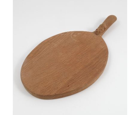 A Robert Thompson of Kilburn Mouseman oak cheese board, of oval form with carved mouse handle, length 14.25ins