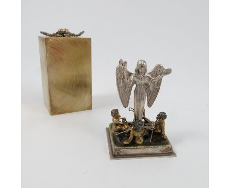 A Stuart Devlin silver and silver gilt surprise Christmas carol present, of rectangular form, opening to reveal an enamel and