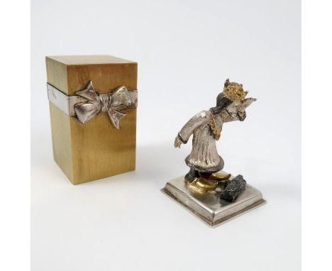 A Stuart Devlin silver and silver gilt surprise Christmas carol present, of rectangular form, opening to reveal an enamel and