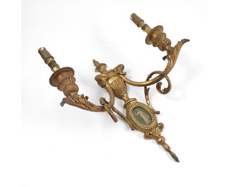 Three early 20th century gilt metal wall light fittings, of Classical decoration, with an urn over a Wedgwood green jasper ov