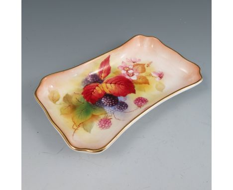 A Royal Worcester rectangular waisted tray, with canted corners and gilded border, hand painted with autumn berries and leave