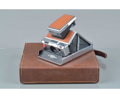 A Polaroid SX-70 Land Camera Alpha 1, tan, untested, body G-VG, bellows G-VG, elements G-VG, with manual, in camera case