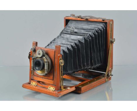 A Mahogany &amp; Brass Quarter Plate Camera, retailed by Sands, Hunter &amp; Co, 37 Bedford Street, London W.C, missing focus