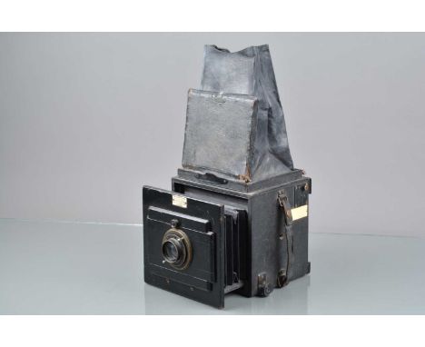 A Watson &amp; Sons Argus 5¼x3¼" Reflex Camera, shutter jammed, body F, some wear/tears to leatherette, no focus/film plate b