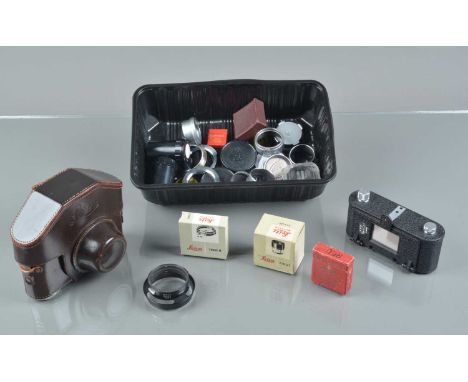 A Group of Leica Accessories, including three M-L39 mount adapter rings, three M body caps, FIKUS variable hood, Summaron-Elm
