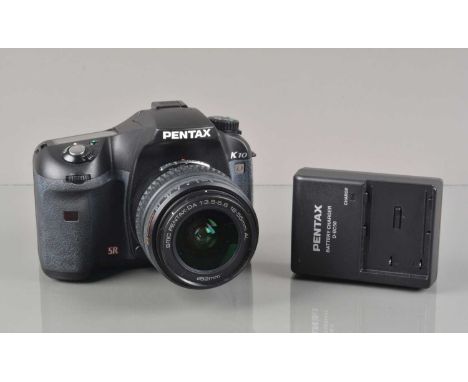 A Pentax K10 DSLR Camera, powers up, shutter working, flash working, body G, light fading to grip, with SMC DA 18-55mm f/3.5-