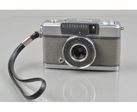 An Olympus Pen EE 35mm Half Frame Camera, shutter working, light cell/aperture responsive, body G, with G Zuiko 2.8cm f/3.5 l