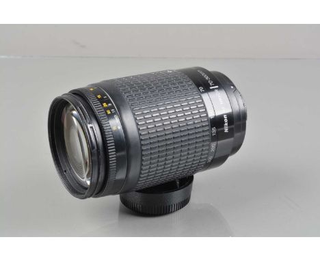 A Nikon AF Nikkor 70-300mm f/4-5.6G Lens, auto focus working, barrel G-VG, elements G-VG, with front/rear caps, manual, in Je