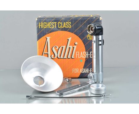 An Asahi Flash Gun, for Asahi-Flex, in VG unused condition, with reflector, camera bracket, battery holder, bulb, sync cable,