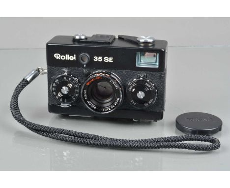 A Rollei 35 SE Compact Camera, black, made in Singapore, shutter sticking in slow speeds, not battery tested, body G-VG, with