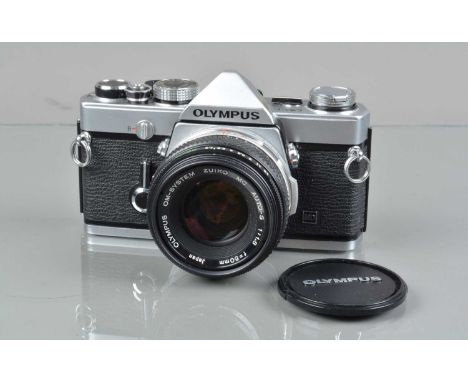 An Olympus OM-1n MD SLR Camera, shutter working, meter unresponsive, self timer working, body G, light wear, with Zuiko MC 50